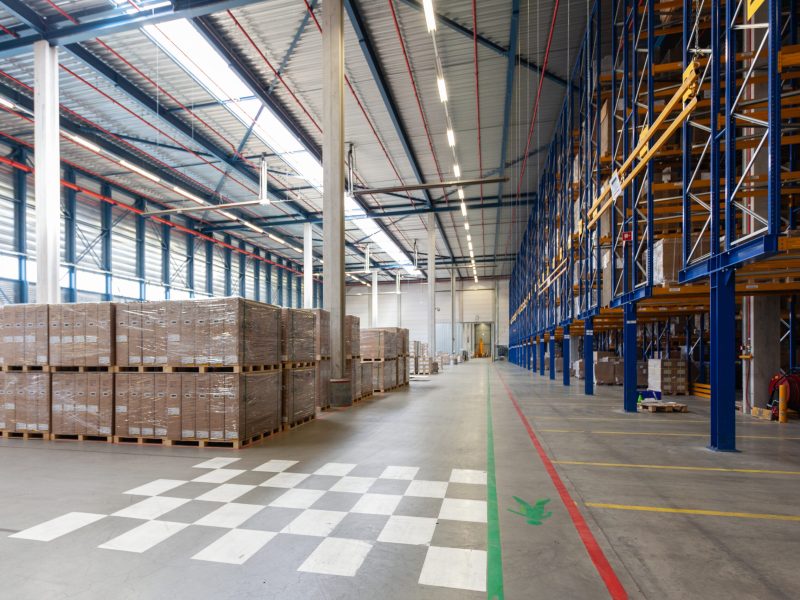 A view of full warehouse with forklift